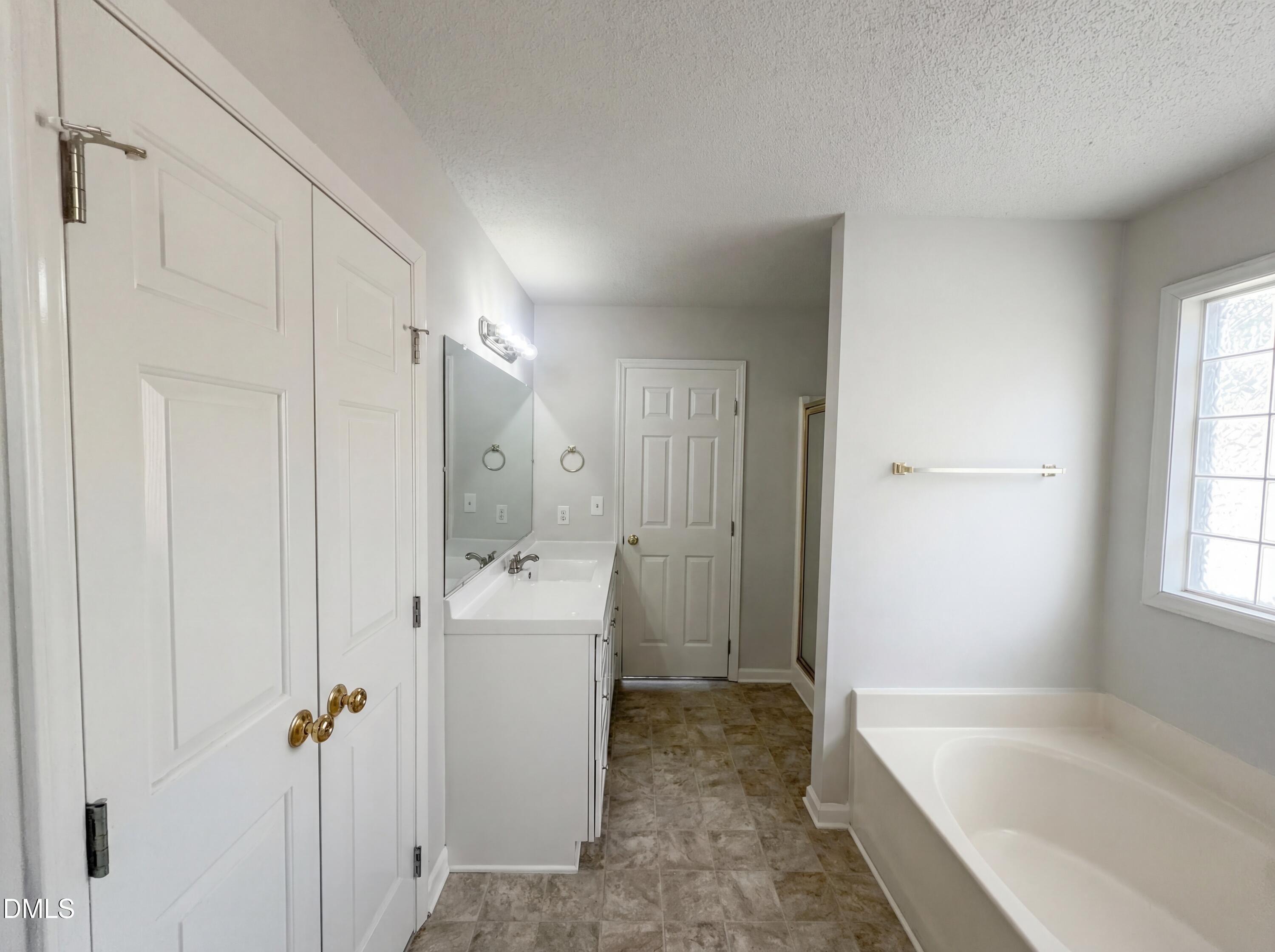 299 Greenleaf Road Angier, NC 27501 - Photo 9 of 15 a bathroom with a tub sink and mirror