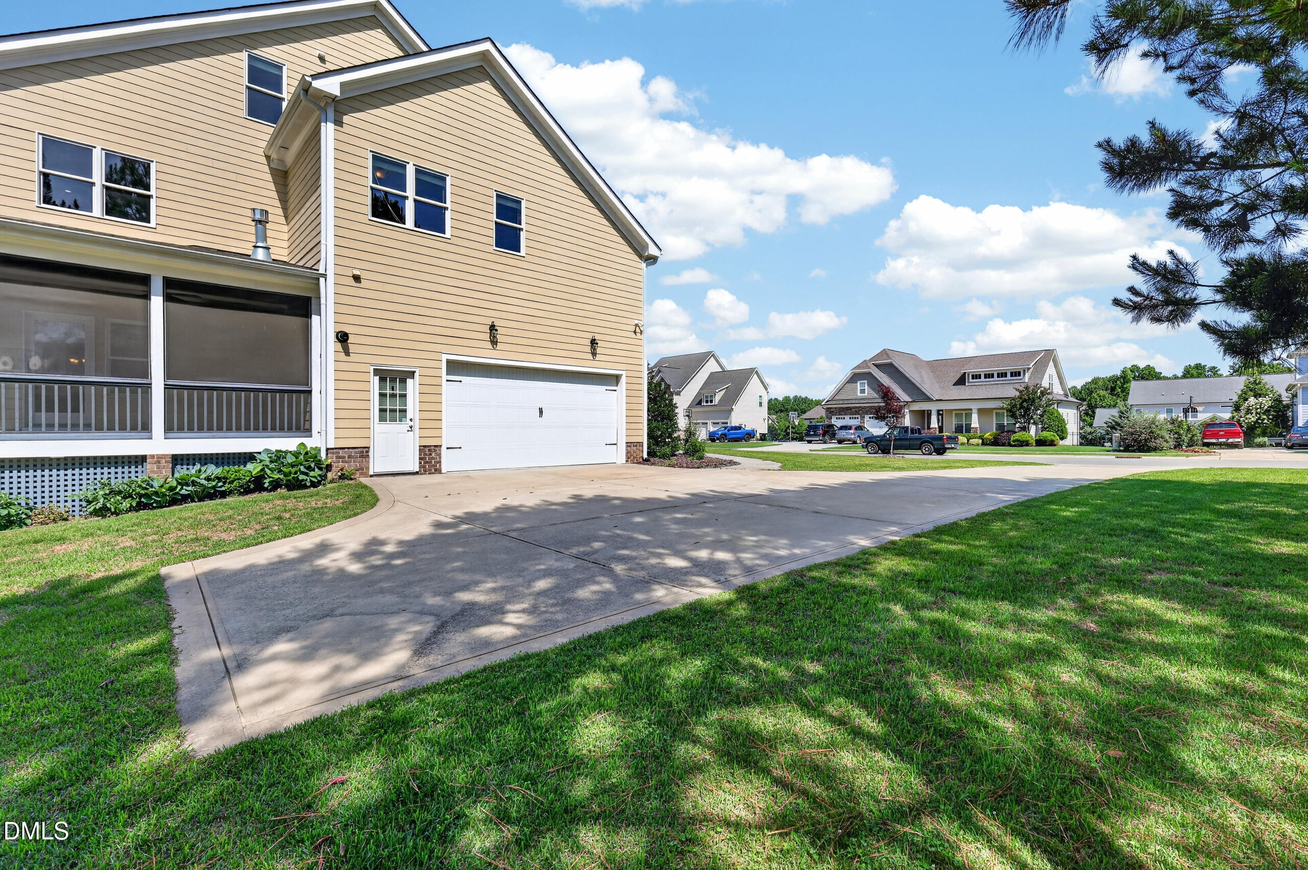 261 Character Drive Rolesville, NC 27571 - Photo 67 of 77 a view of a white house with a yard and sitting area