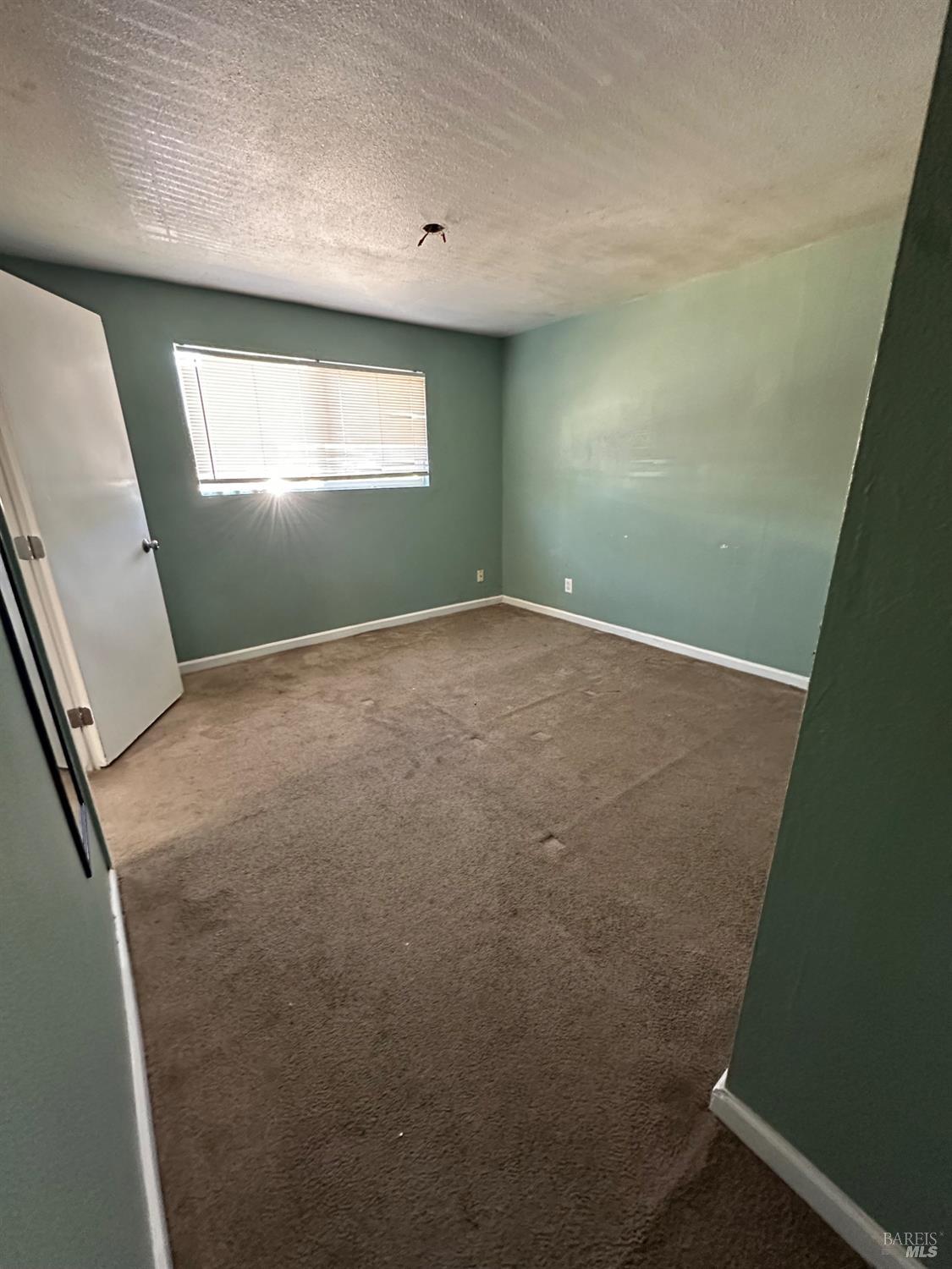 1815 Ohio Street Vallejo, CA 94590 - Photo 5 of 8 an empty room with windows
