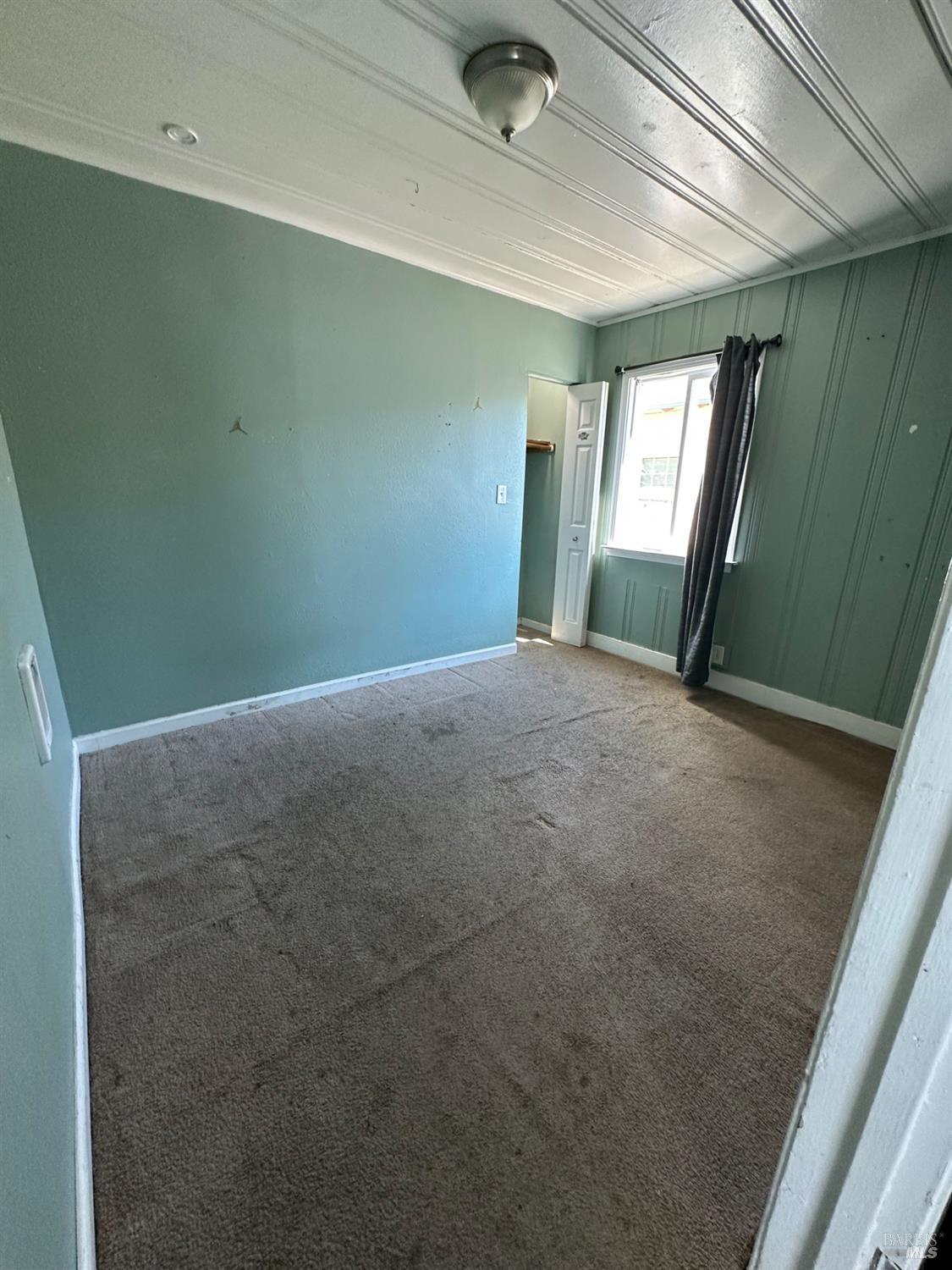 1815 Ohio Street Vallejo, CA 94590 - Photo 7 of 8 a view of an empty room with window and bathroom
