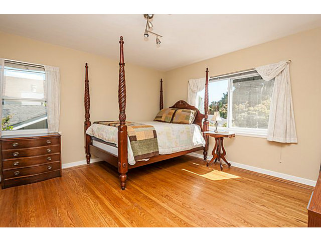 29 Dwight Road Burlingame, CA 94010 - Photo 12 of 20 a living room with a bed furniture and a window