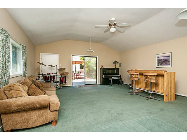 29 Dwight Road Burlingame, CA 94010 - Photo 16 of 20 a living room with furniture and a chandelier