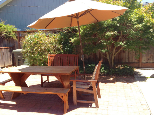 29 Dwight Road Burlingame, CA 94010 - Photo 17 of 20 a patio view with table and chairs under an umbrella