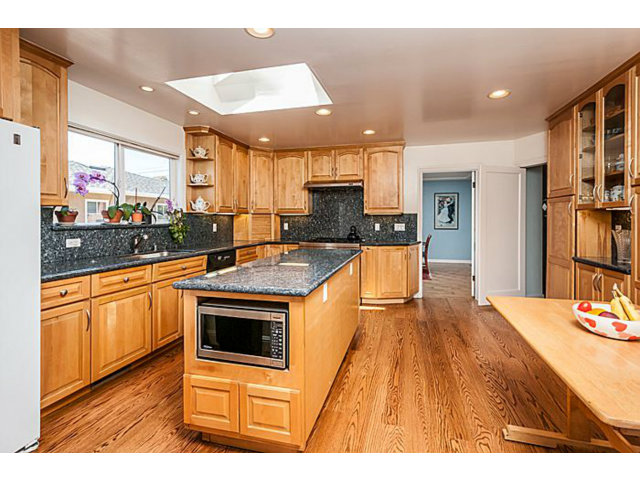 29 Dwight Road Burlingame, CA 94010 - Photo 5 of 20 a kitchen with stainless steel appliances kitchen island granite countertop a stove and a sink