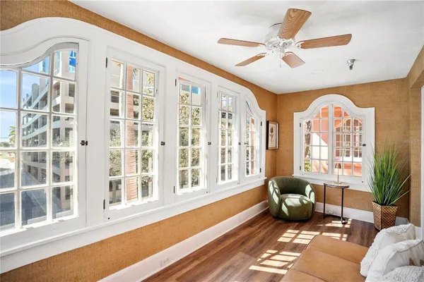 a view of a hallway with entryway wooden floor and front door