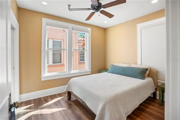 a bedroom with a bed and a walk in closet