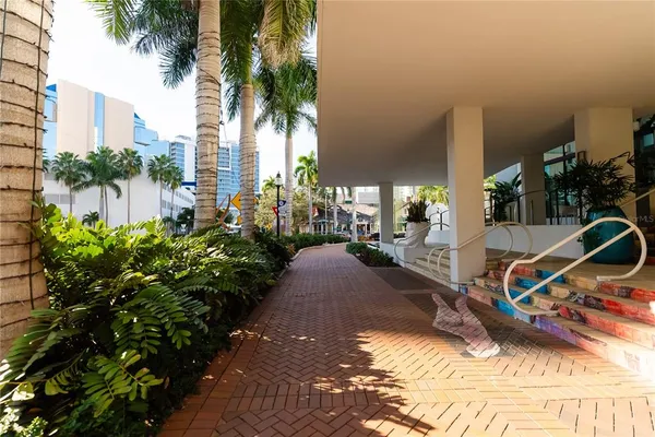 a view of a house with a patio and a yard