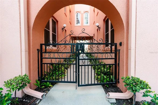 a view of a hallway with a potted plant