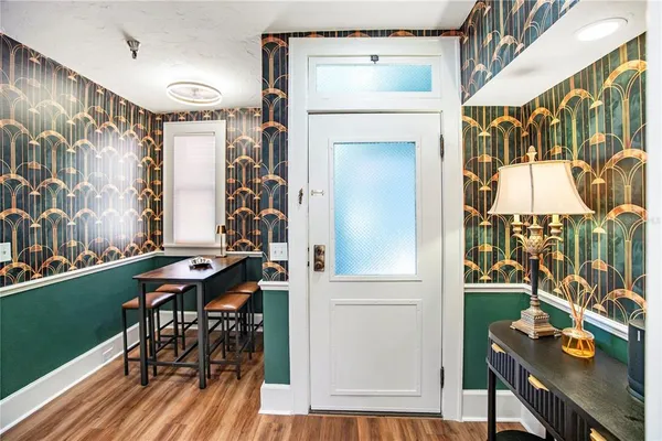 a view of a hallway and dining room