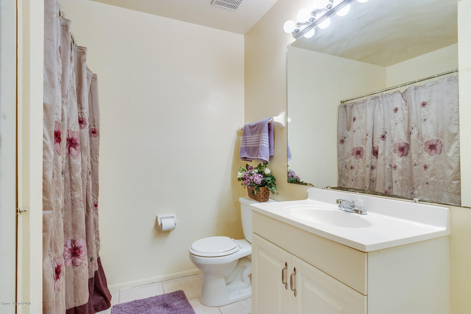 1586 Creel Road Northeast Palm Bay, FL 32905 - Photo 11 of 21 a bathroom with a sink toilet and shower