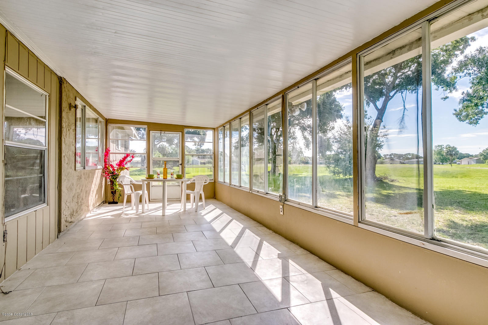 1586 Creel Road Northeast Palm Bay, FL 32905 - Photo 16 of 21 a lobby with furniture and large windows