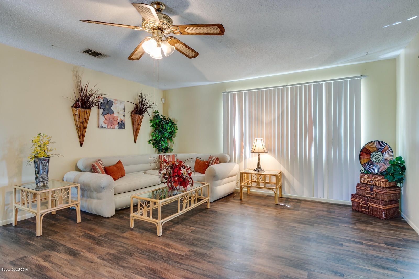 1586 Creel Road Northeast Palm Bay, FL 32905 - Photo 6 of 21 a living room with furniture and wooden floor