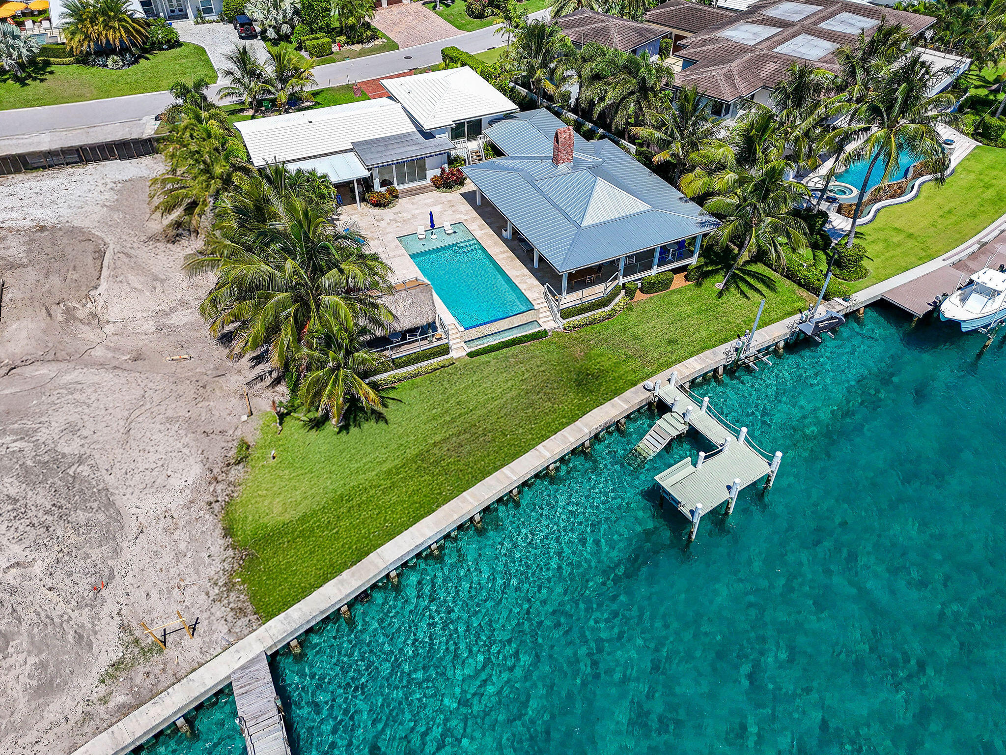 87 Lighthouse Drive Jupiter Inlet Colony, FL 33469 - Photo 14 of 33 an aerial view of a house with a garden