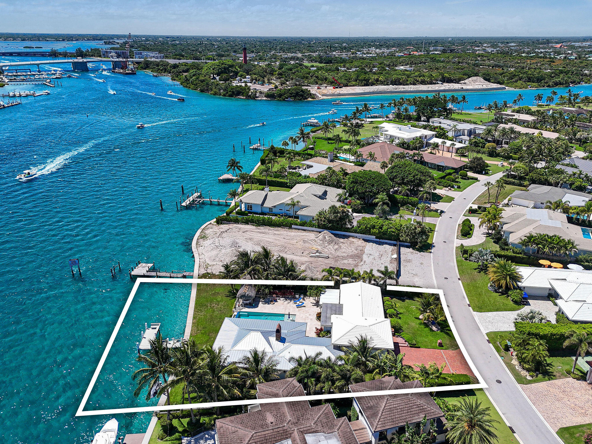 87 Lighthouse Drive Jupiter Inlet Colony, FL 33469 - Photo 9 of 33 an aerial view of lake with residential houses with outdoor space