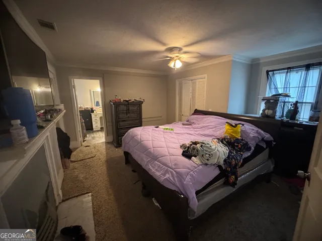 a view of bathroom with a sink and a mirror