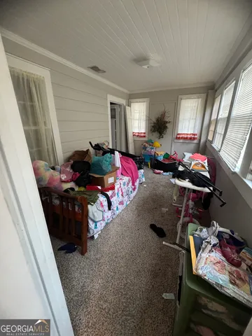 a view of a livingroom with furniture and windows