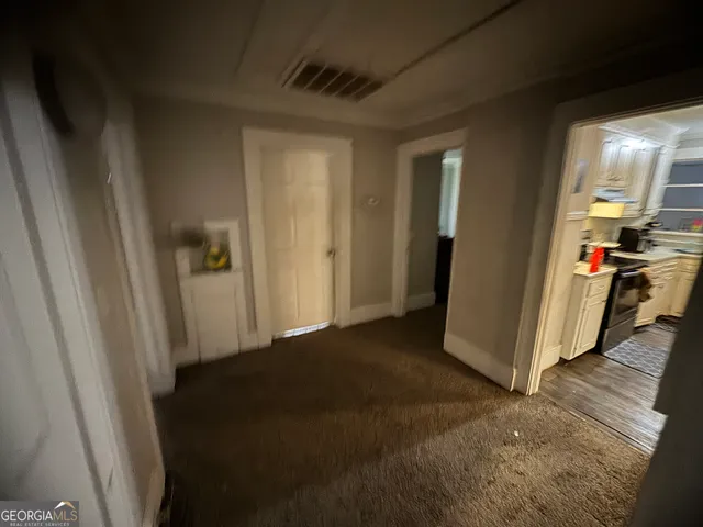 a bedroom with bed and a chandelier