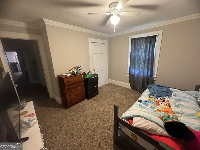 a view of living room with furniture and flat screen tv