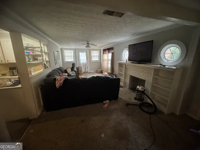 a kitchen with stainless steel appliances granite countertop a refrigerator a stove and a sink