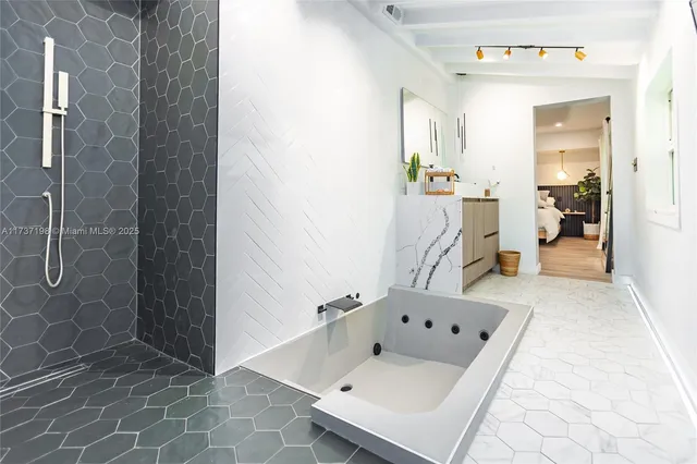 a bathroom with a shower and a sink