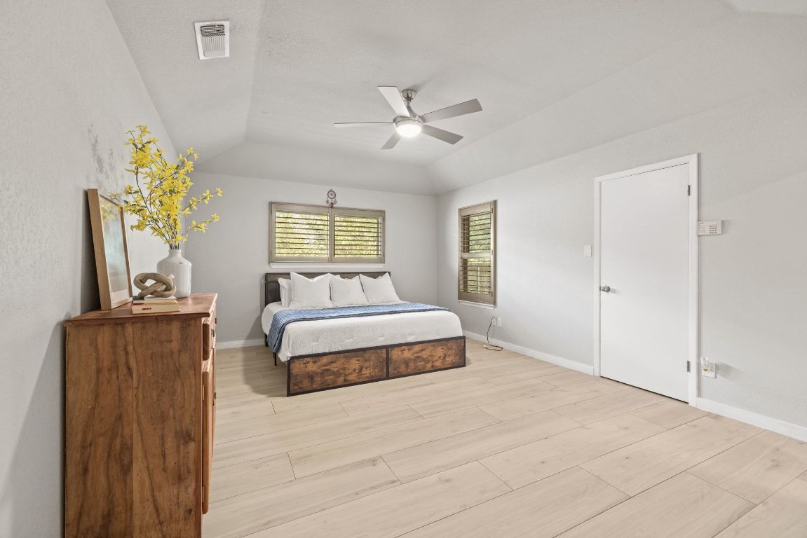 1805 Ryon Cove Round Rock, TX 78681 - Photo 13 of 23 a spacious bedroom with a bed and window