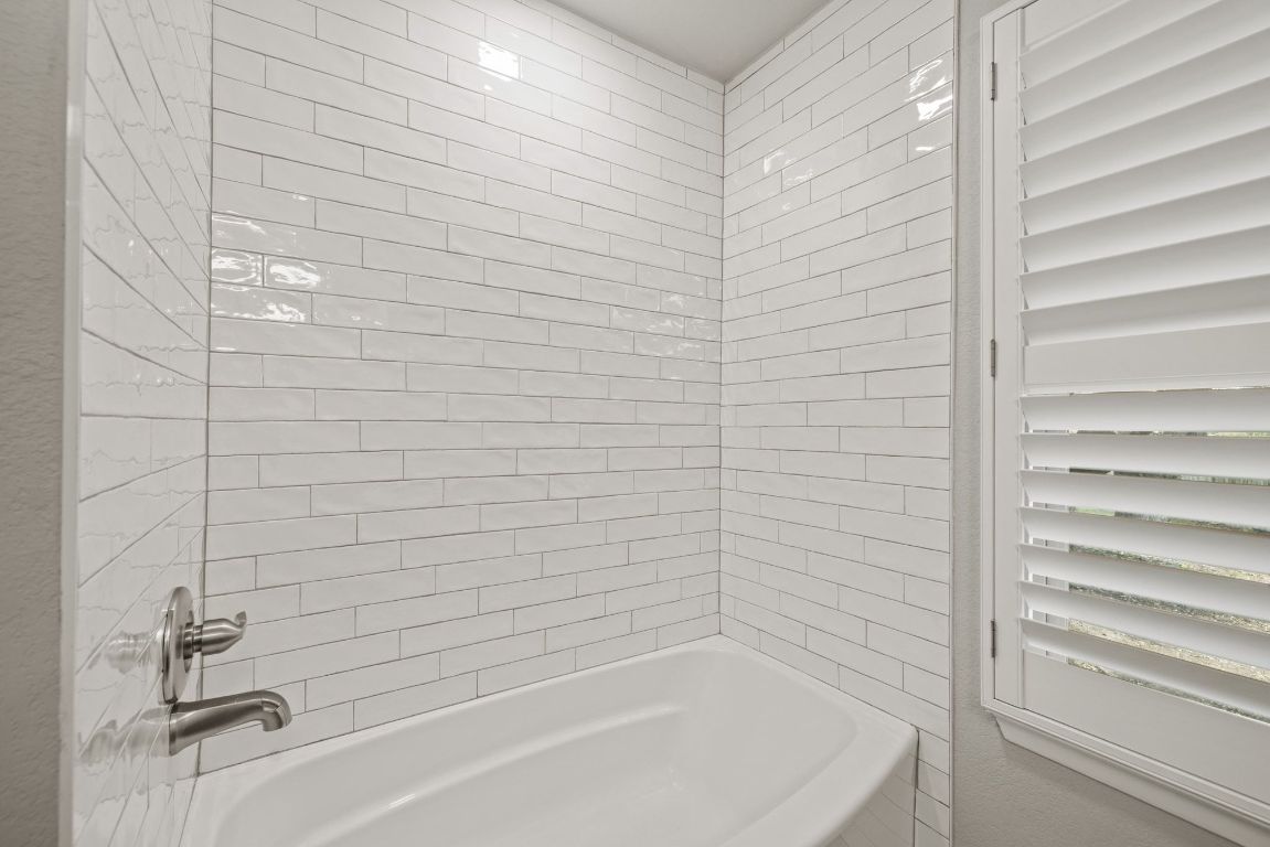 1805 Ryon Cove Round Rock, TX 78681 - Photo 16 of 23 a bathroom with a bathtub