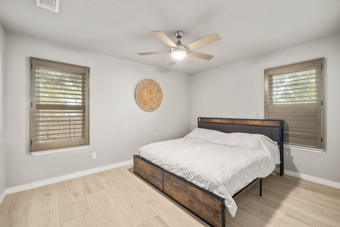 1805 Ryon Cove Round Rock, TX 78681 - Photo 17 of 23 a large bed sitting in a bedroom next to a window