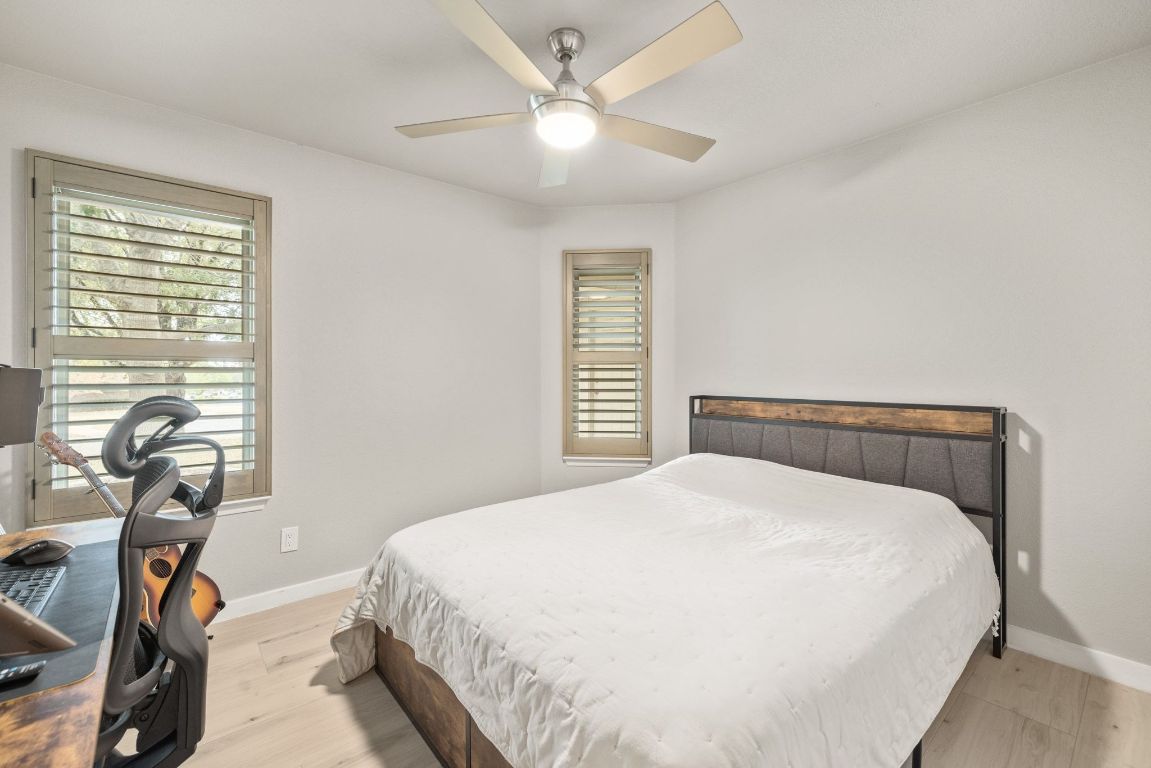 1805 Ryon Cove Round Rock, TX 78681 - Photo 18 of 23 a bedroom with a bed and a large window