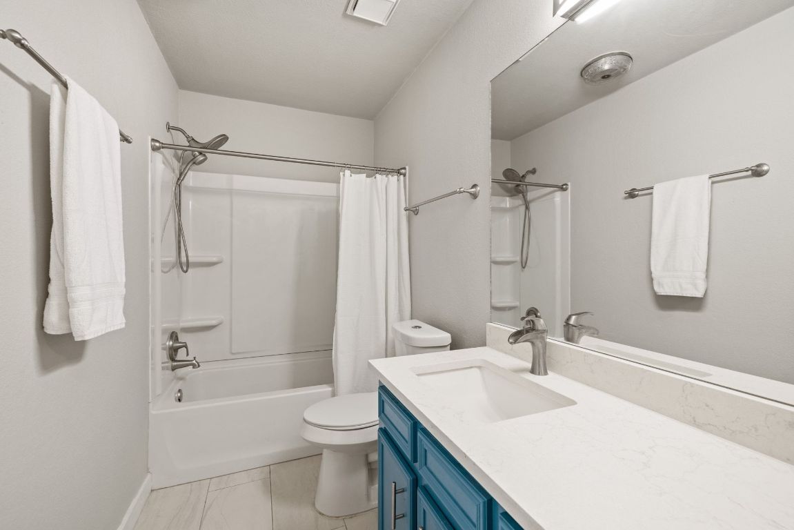 1805 Ryon Cove Round Rock, TX 78681 - Photo 19 of 23 a bathroom with a sink toilet tub and shower