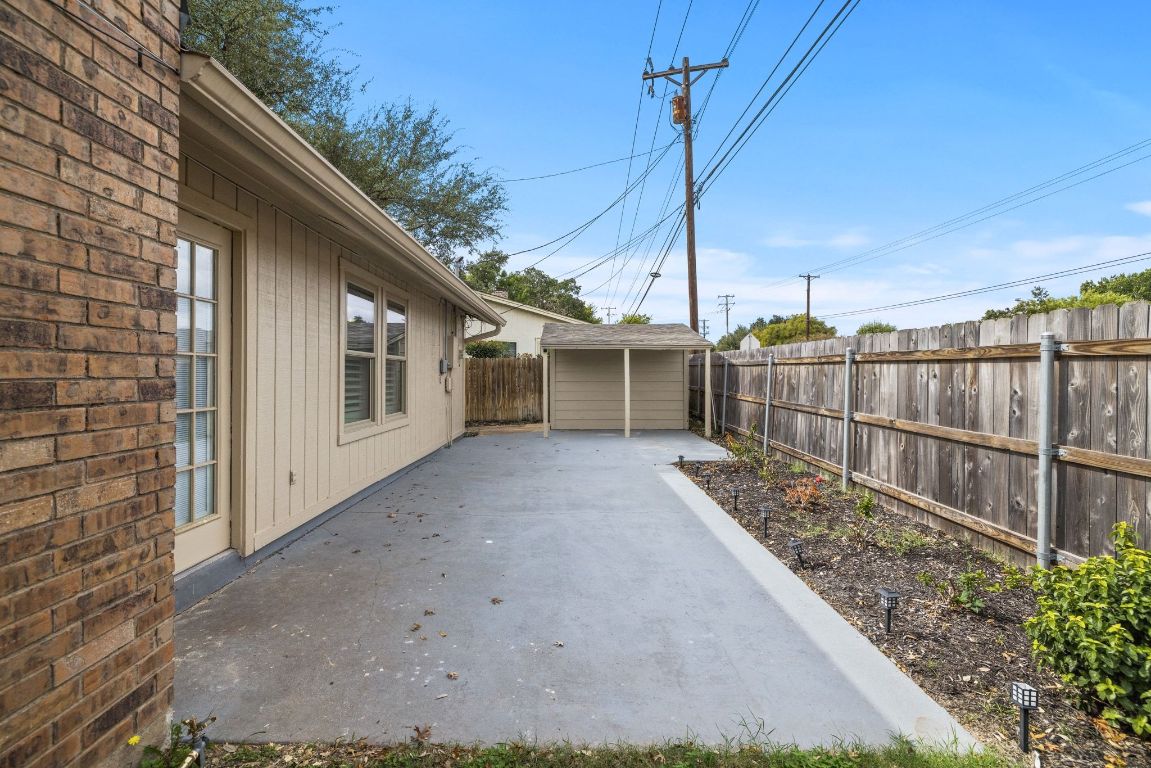 1805 Ryon Cove Round Rock, TX 78681 - Photo 20 of 23 a view of a house with a small yard and wooden fence