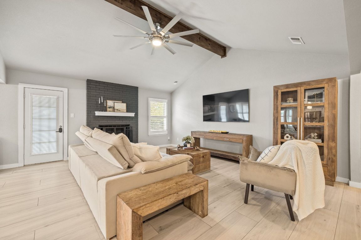1805 Ryon Cove Round Rock, TX 78681 - Photo 7 of 23 a living room with furniture and a flat screen tv