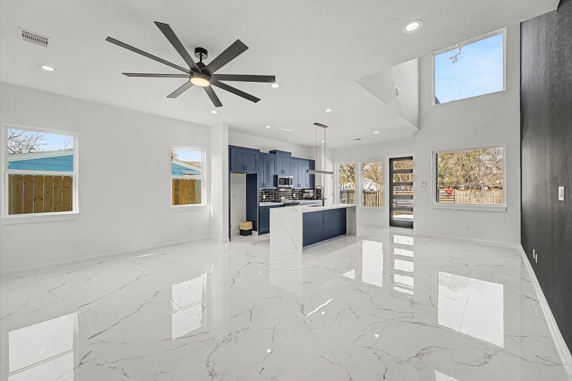 5034 Pershing Street, Unit B Houston, TX 77033 - Photo 11 of 26 a view of a kitchen with furniture and a ceiling fan