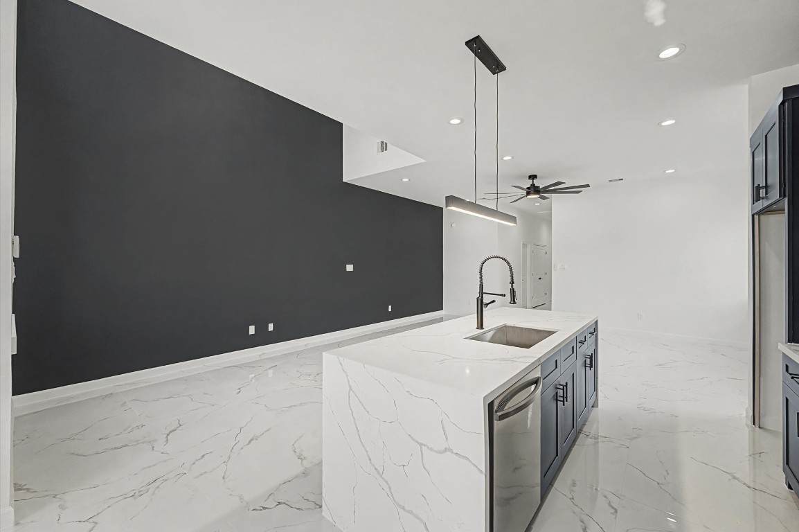 5034 Pershing Street, Unit B Houston, TX 77033 - Photo 13 of 26 a kitchen with a sink and a refrigerator