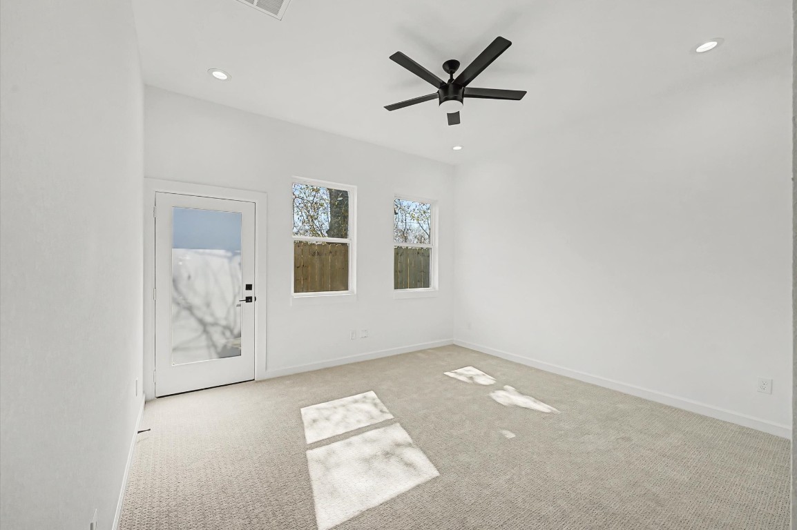 5034 Pershing Street, Unit B Houston, TX 77033 - Photo 14 of 26 an empty room with window and ceiling fan