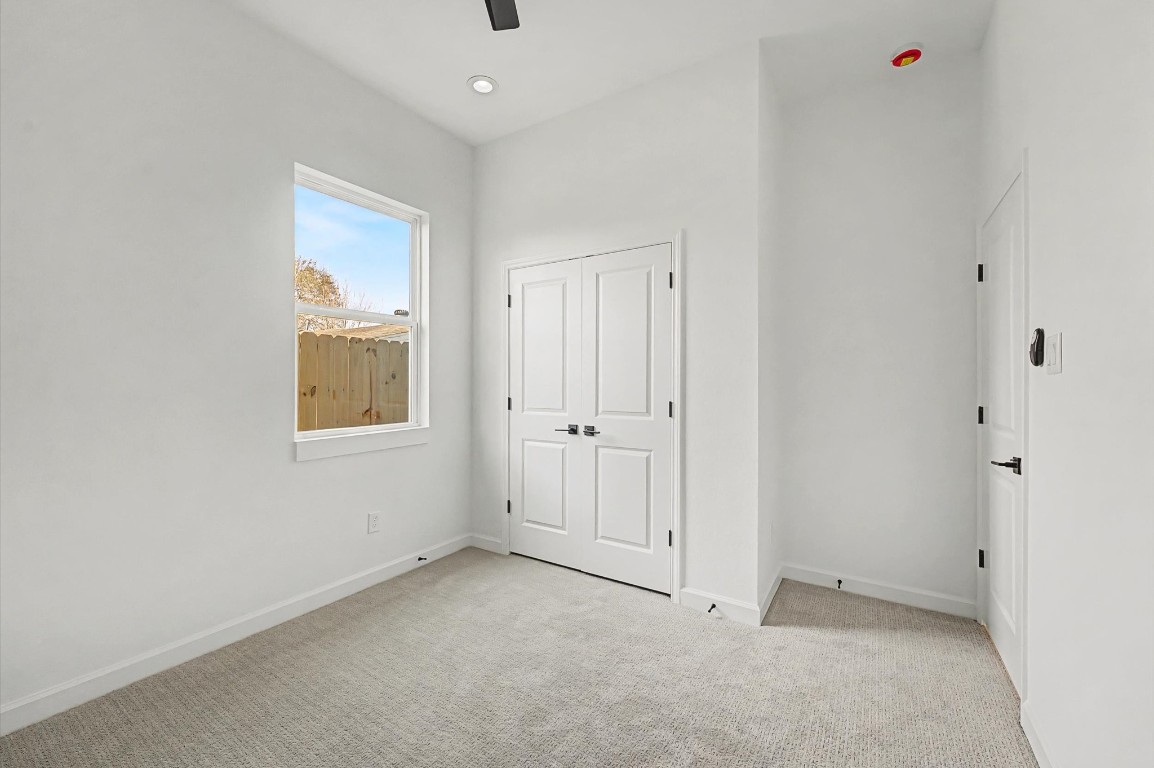 5034 Pershing Street, Unit B Houston, TX 77033 - Photo 20 of 26 an empty room with windows and closet