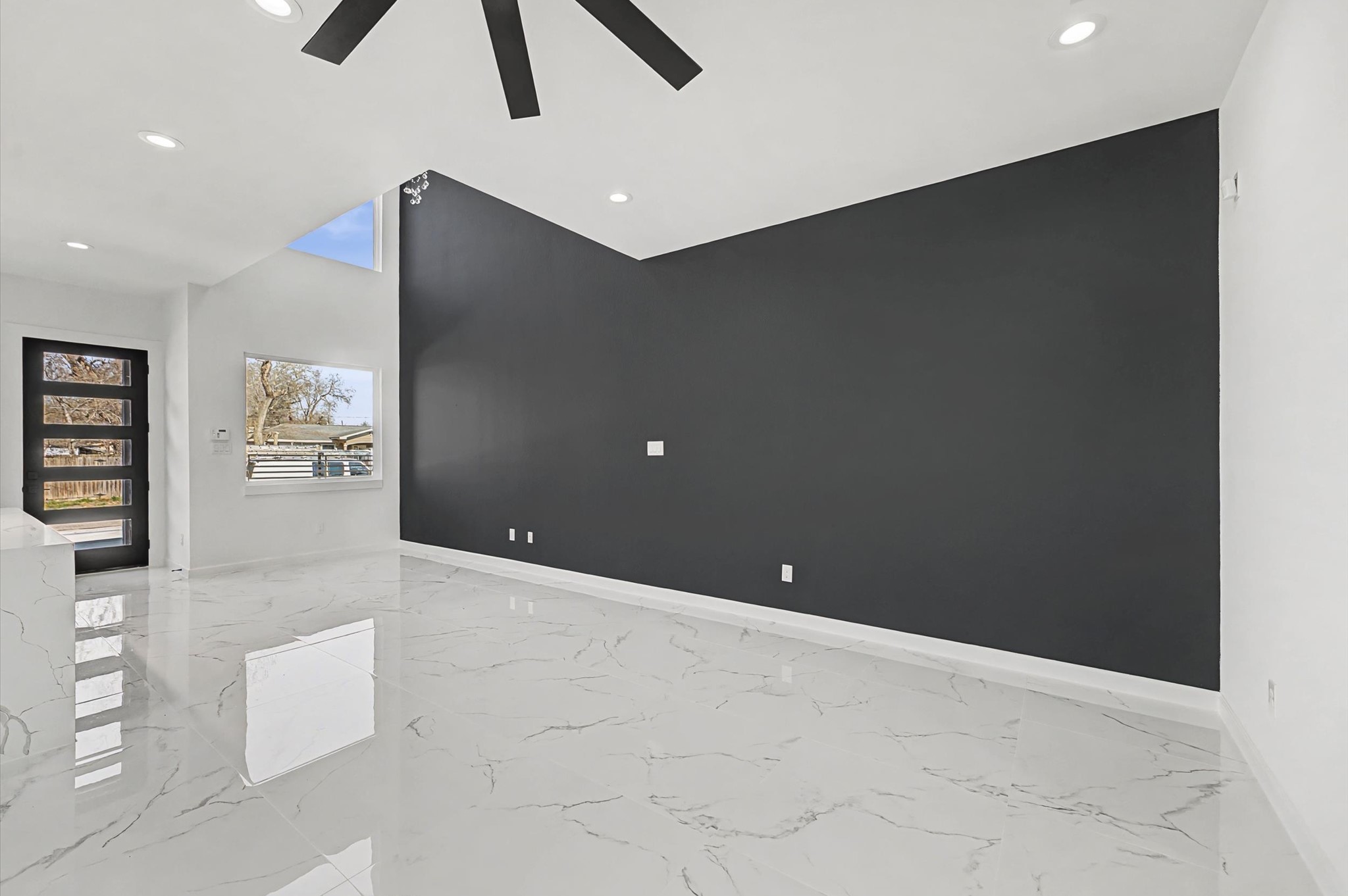 5034 Pershing Street, Unit B Houston, TX 77033 - Photo 9 of 26 a view of an empty room with windows