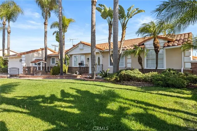 a front view of a house with swimming pool having outdoor seating