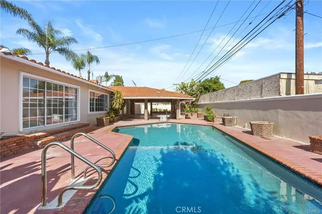 a vase of flowers sitting on a floor