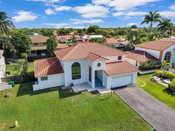 a aerial view of a house with garden