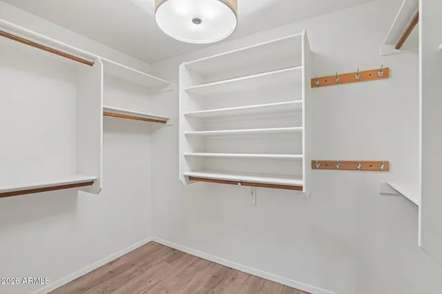 a bathroom with double sink and a mirror