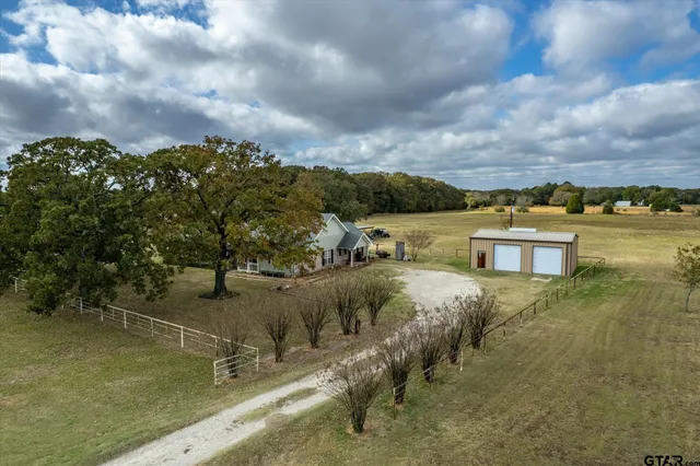 a view of a lake with a yard