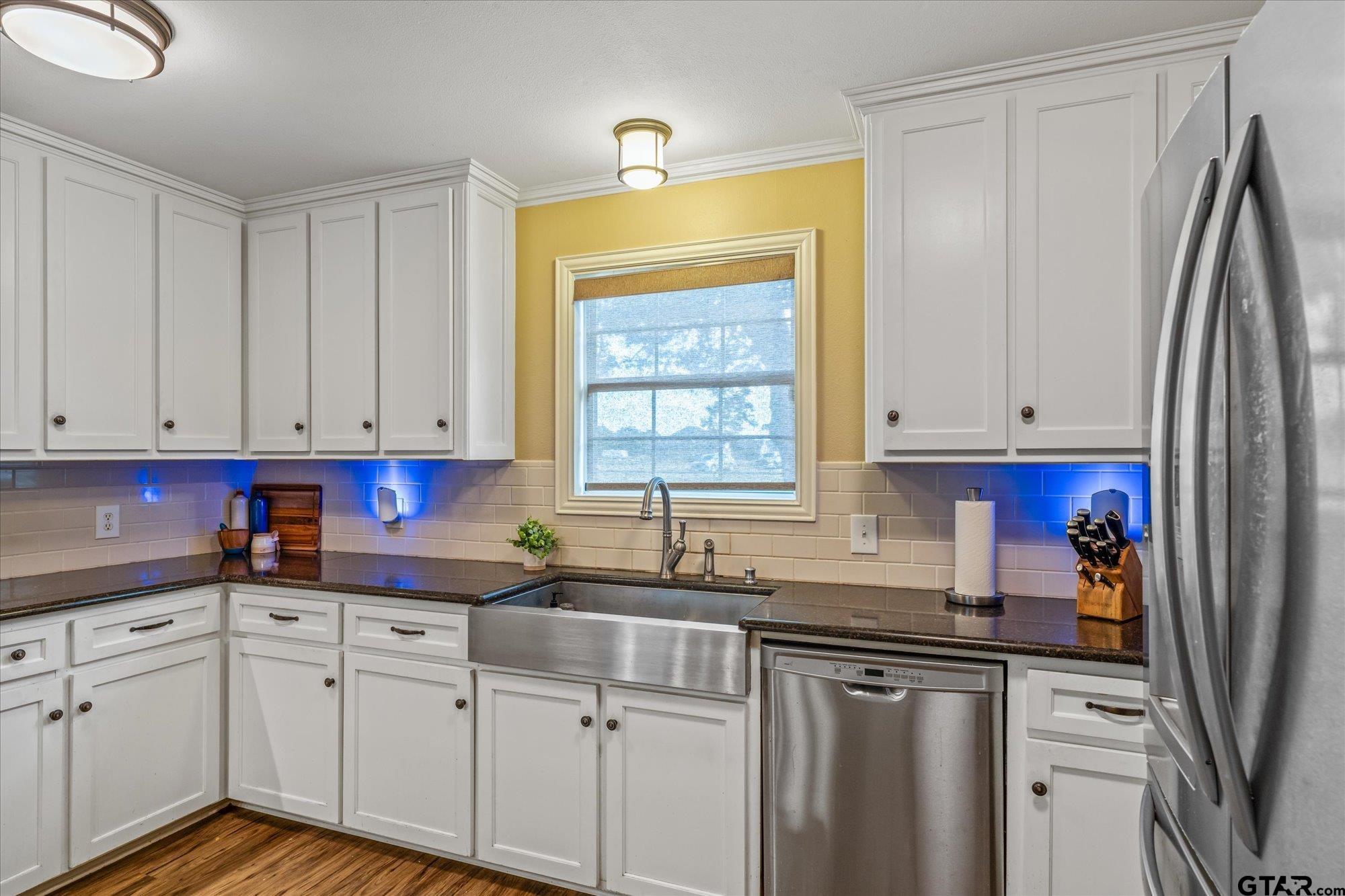 16140 County Road 4009 Mabank, TX 75147 - Photo 8 of 31 a kitchen with stainless steel appliances granite countertop a sink a refrigerator and cabinets