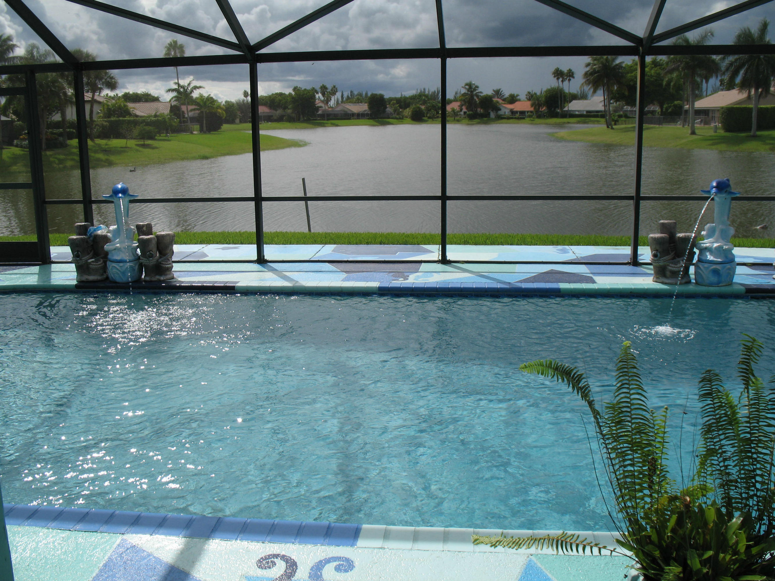 11360 Lake Tree Court Boca Raton, FL 33498 - Photo 4 of 27 POOL OVERLOOKS 180 DEGREE LAKE VIEWS