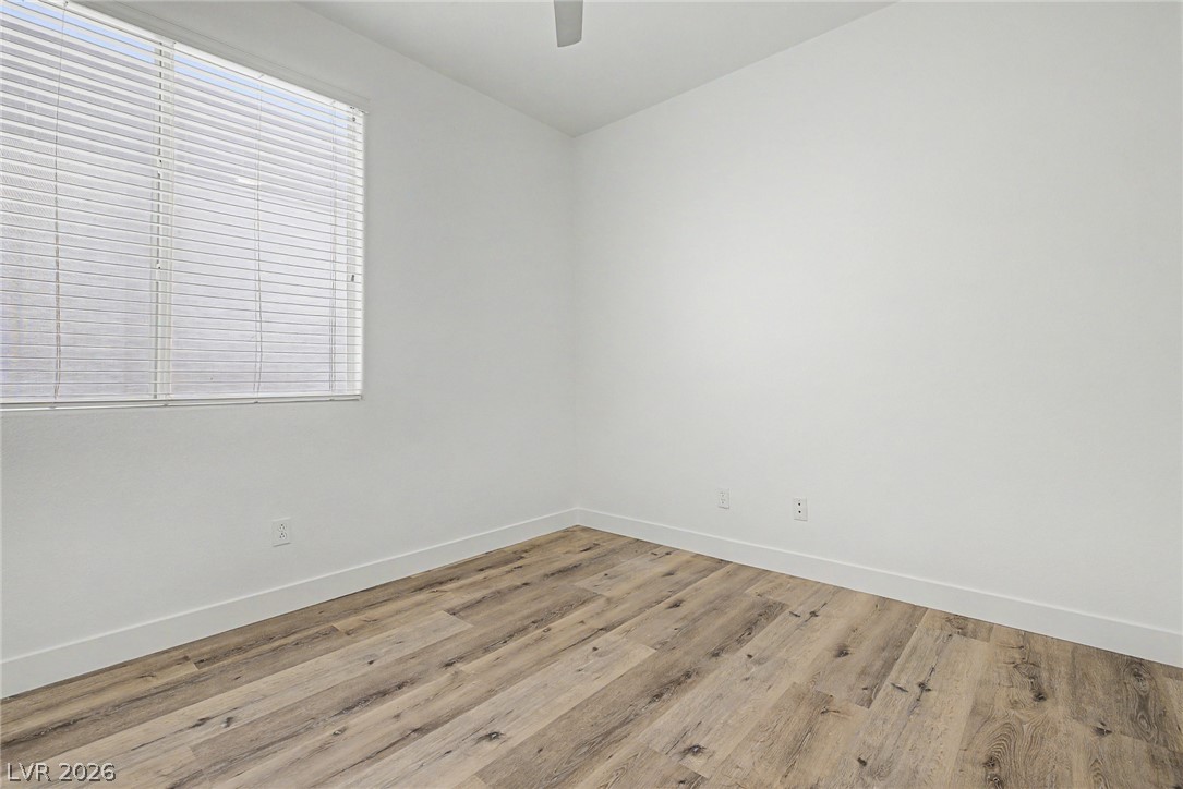 835 Entrada Ridge Avenue Henderson, NV 89012 - Photo 24 of 34 A well-lit room with wood flooring, ready for personalization.