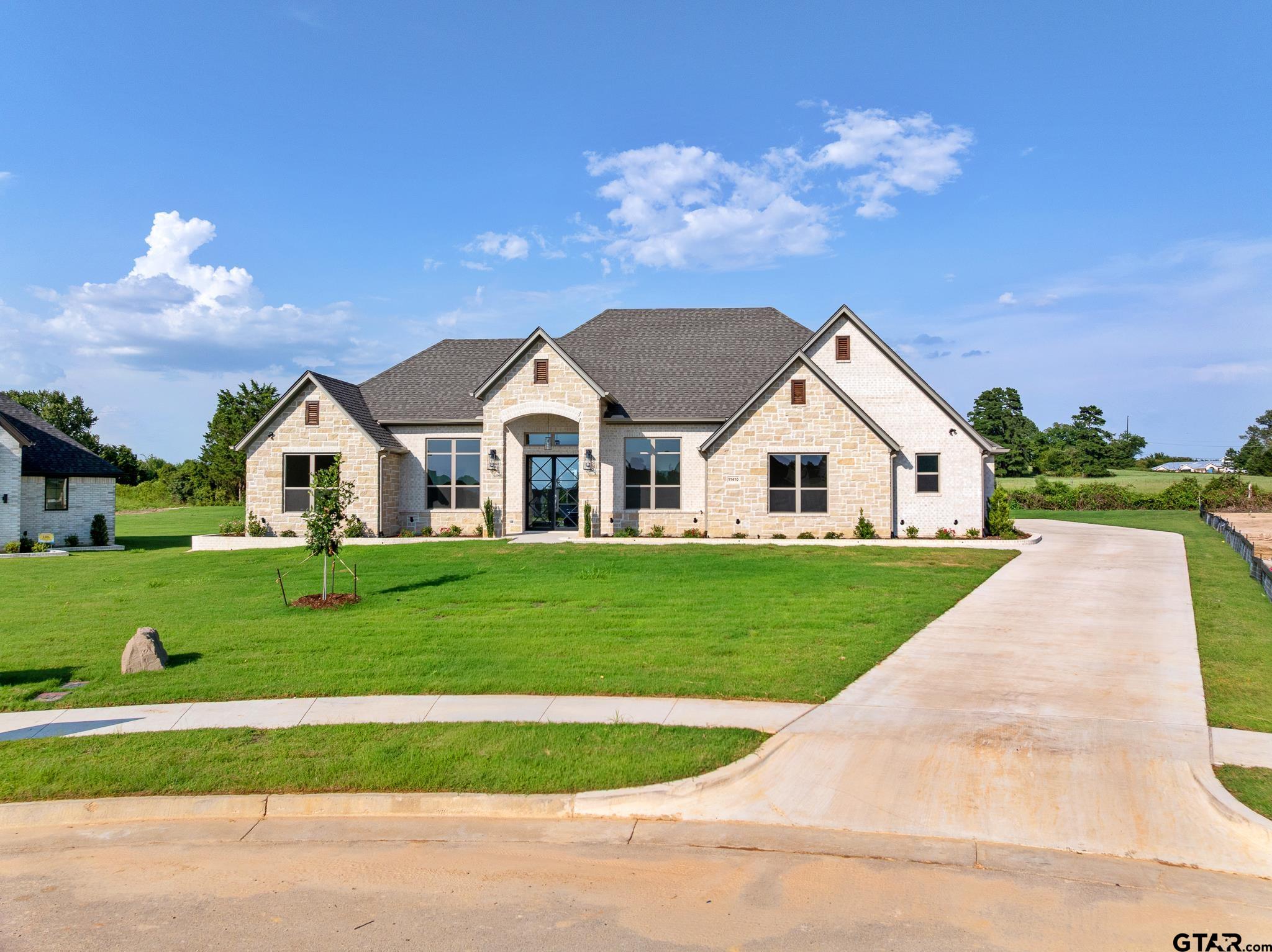 a view of house with outdoor space and street view