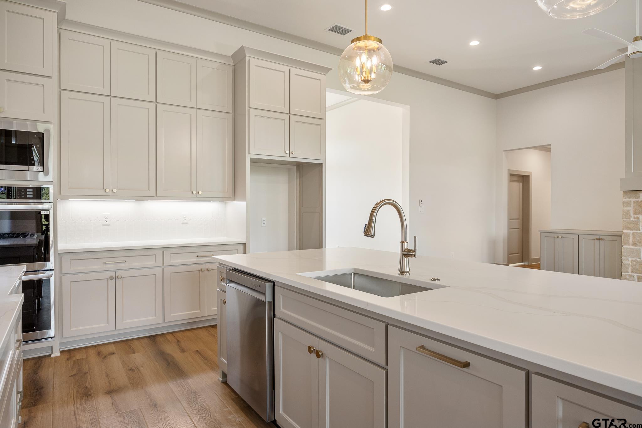 11410 Tucker Circle Flint, TX 75762 - Photo 18 of 43 a kitchen with a sink cabinets and appliances