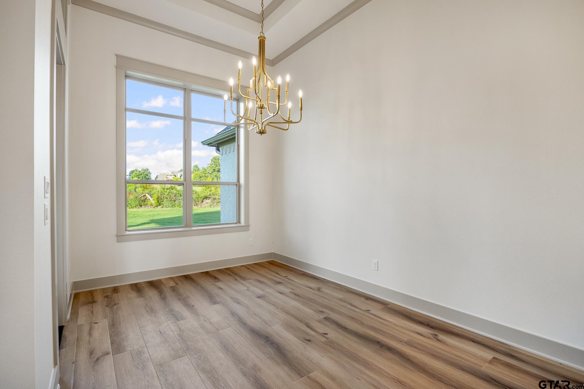 11410 Tucker Circle Flint, TX 75762 - Photo 21 of 43 wooden floor in an empty room with a window