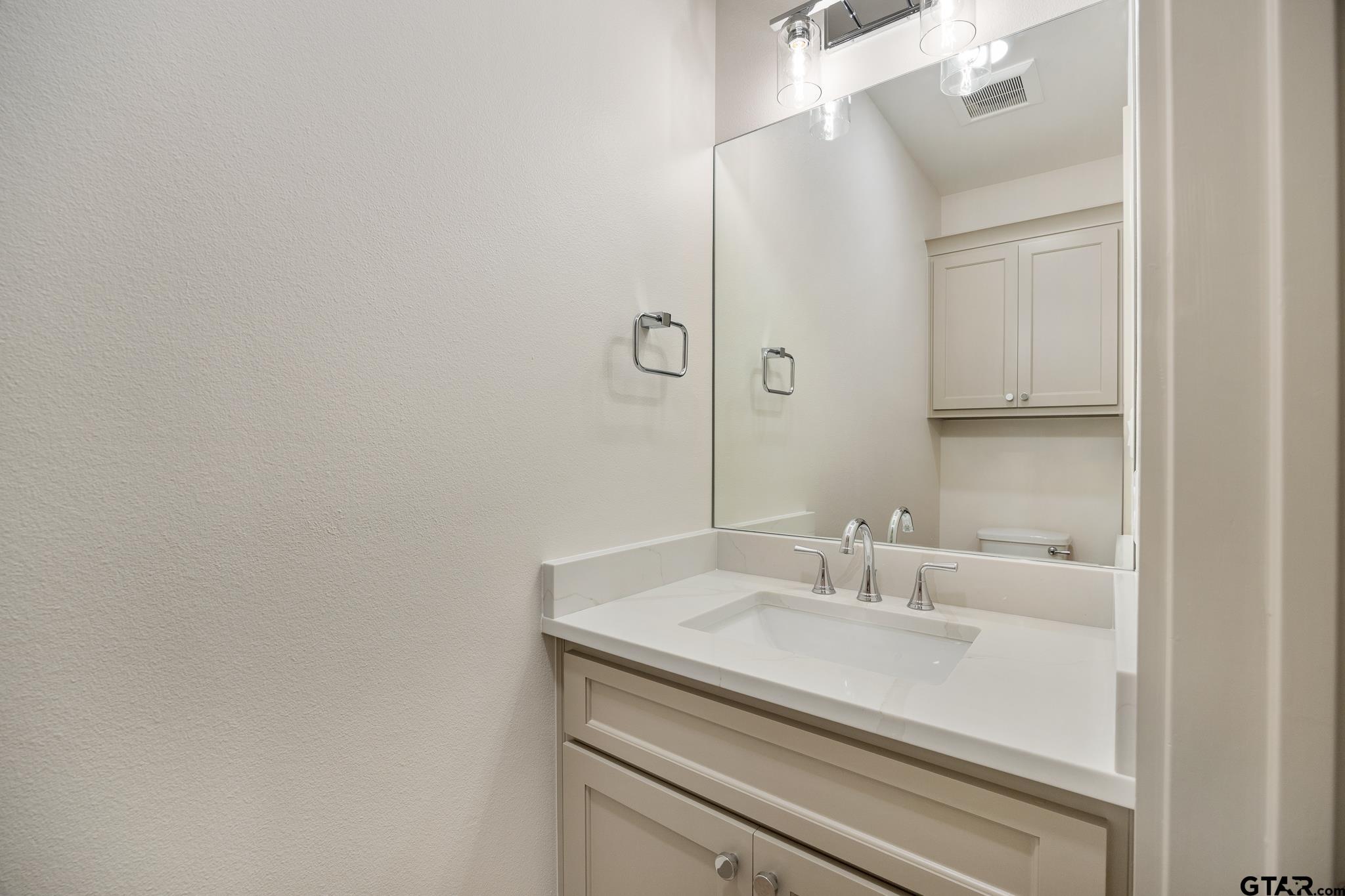 11410 Tucker Circle Flint, TX 75762 - Photo 24 of 43 a bathroom with a sink and a mirror