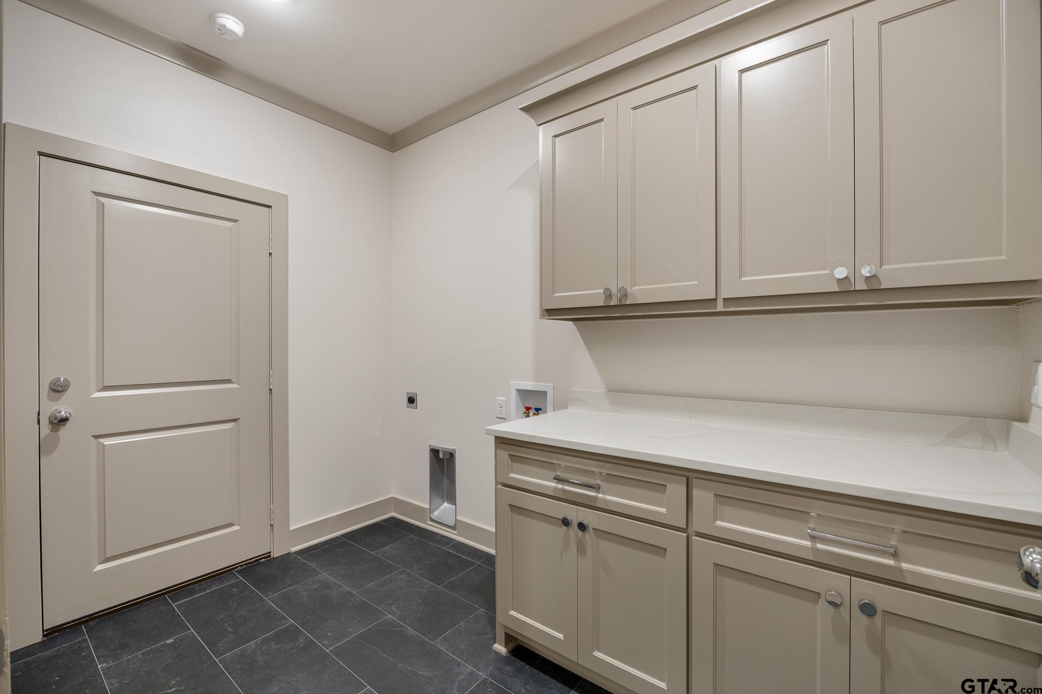 11410 Tucker Circle Flint, TX 75762 - Photo 25 of 43 a view of cabinets and utility room with closet
