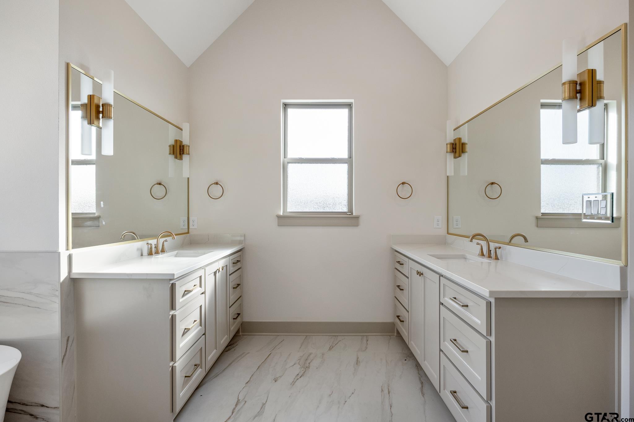 11410 Tucker Circle Flint, TX 75762 - Photo 29 of 43 a spacious bathroom with a double vanity sink mirror and bathtub